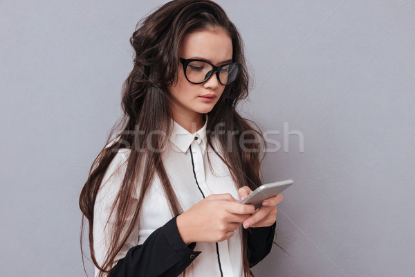 Asian woman with phone Stock photo © deandrobot