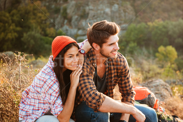 Hiking couple. Young active couple having fun outdoors in valley. Stock photo © deandrobot