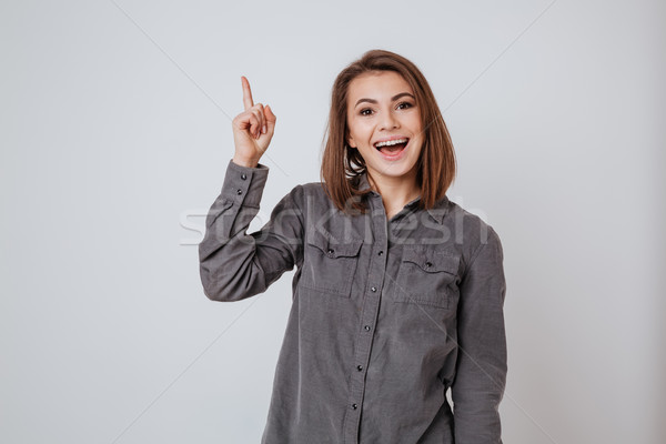 Happy young lady have an idea Stock photo © deandrobot