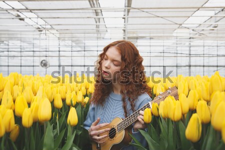 Shot of lying on flowers woman Stock photo © deandrobot