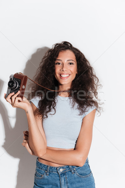 Stock photo: Pretty woman holding photocamera isolated