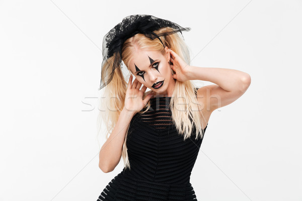Attrattivo donna bionda nero vedova costume posa Foto d'archivio © deandrobot