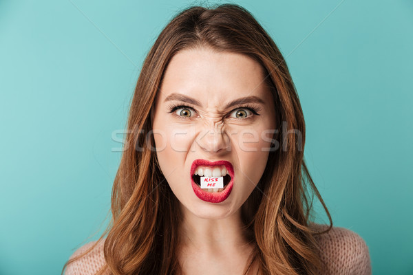 Close up portrait of a furious brown haired woman Stock photo © deandrobot