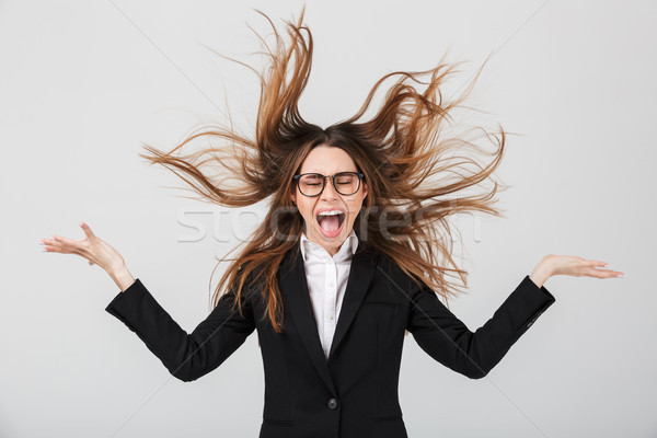 Portrait of an angry businesswoman dressed in suit Stock photo © deandrobot