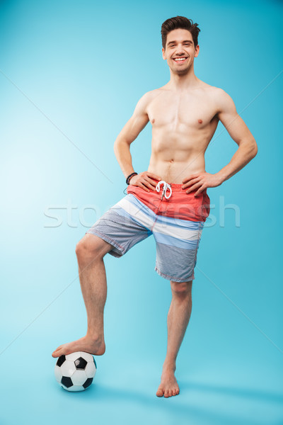 Full length portrait if a cheerful shirtless man Stock photo © deandrobot