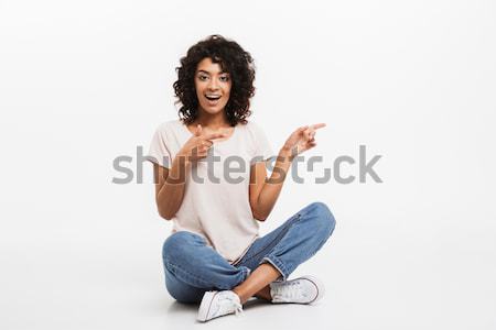 Portrait of smiling young afro american woman Stock photo © deandrobot