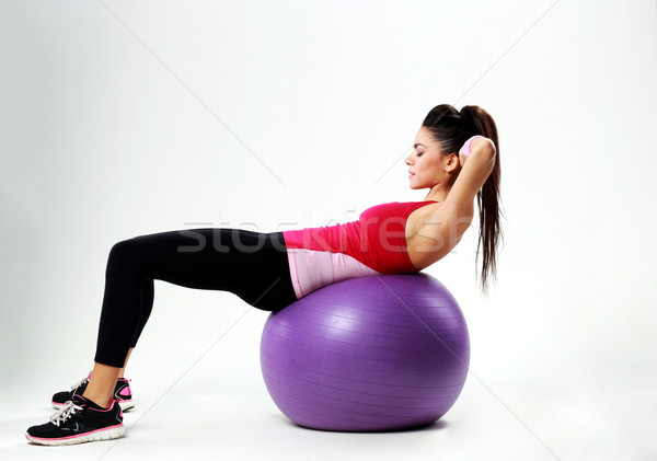 Jeunes sport femme entraînement gris sourire [[stock_photo]] © deandrobot