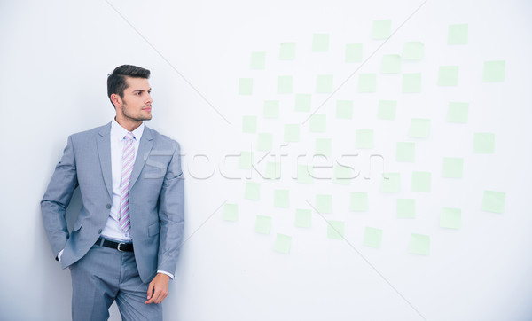 Biznesmen ściany patrząc naklejki działalności Zdjęcia stock © deandrobot