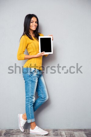 Woman showing blank tablet computer screen  Stock photo © deandrobot