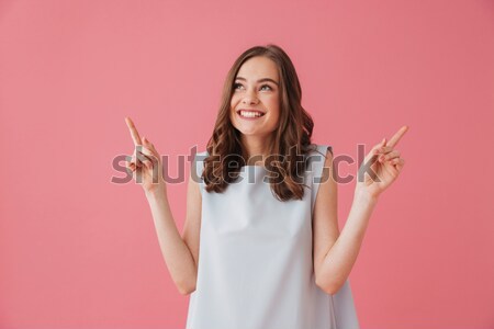 Cheerful redhead woman showing thumbs up with both hands Stock photo © deandrobot