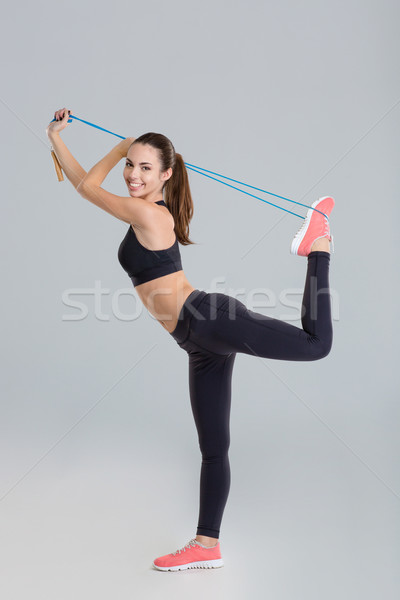 アクティブ ポジティブ 小さな フィットネス女性 ストレッチング ジャンプ ストックフォト © deandrobot