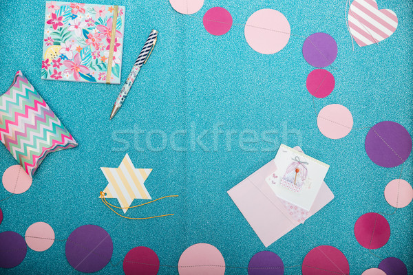 Colorful decorations, notepad, pen and present box on shining  backgound Stock photo © deandrobot