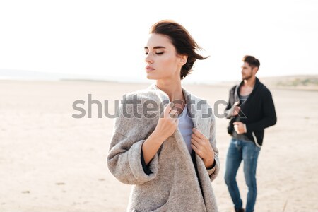 Attractive young couple standing at the seashore in the morning Stock photo © deandrobot