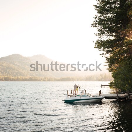 Man standing on a boat Stock photo © deandrobot