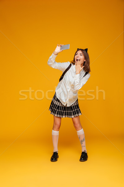 Retrato funny colegiala uniforme Foto stock © deandrobot