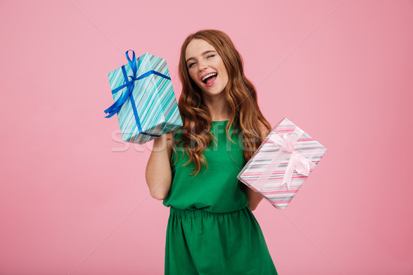 Portrait of a happy delighted woman in dress Stock photo © deandrobot