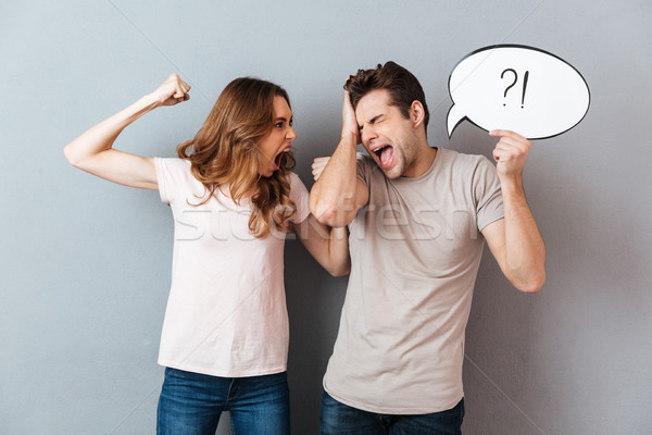 Portrait of a young furious couple having an argument Stock photo © deandrobot