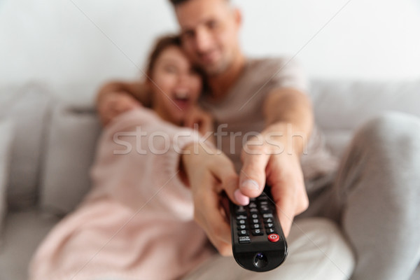 Close up of a happy young couple sitting on a couch Stock photo © deandrobot
