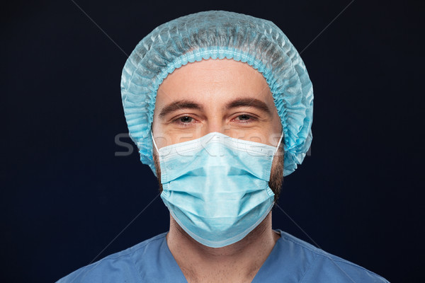 Close up portrait of a male surgeon Stock photo © deandrobot