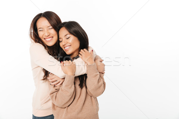 Twee asian cute dames zusters permanente Stockfoto © deandrobot