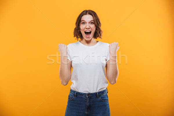 Opgewonden jonge vrouw winnaar gebaar afbeelding Stockfoto © deandrobot