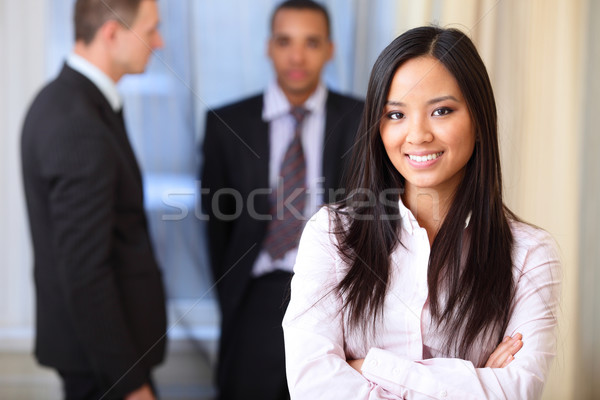Portrait of a young beautiful asian woman in a business environment Stock photo © deandrobot