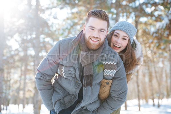 ?ouple looking at camera in winter park Stock photo © deandrobot
