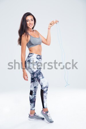 Happy lady drinking aerated sweet water. Stock photo © deandrobot