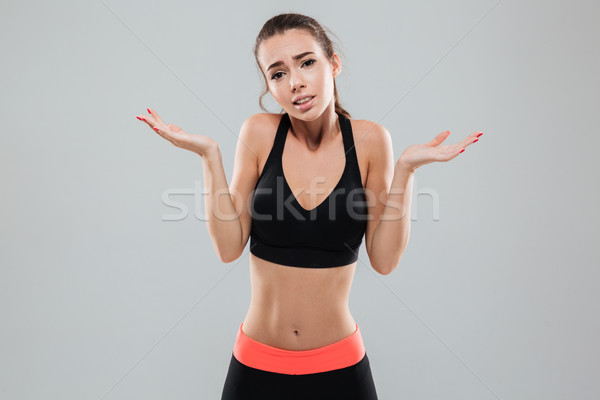 Sport vrouw schouders naar camera grijs Stockfoto © deandrobot
