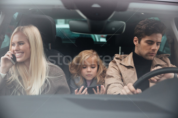 Family sitting in car Stock photo © deandrobot