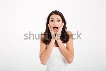 Portrait of an astonished girl dressed in tank-top Stock photo © deandrobot