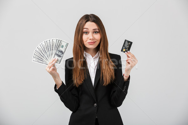 Portré elragadtatott üzletasszony öltöny tart köteg Stock fotó © deandrobot