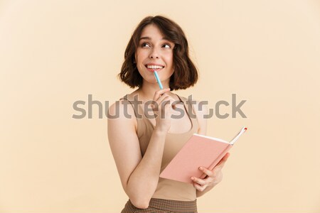 Cheerful lady chatting by mobile phone. Stock photo © deandrobot
