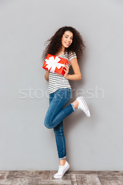 Full size picture of charming adult girl posing on camera with g Stock photo © deandrobot