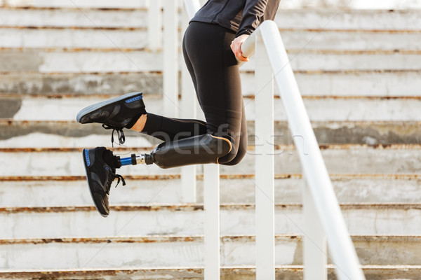 Cropped image of disabled sporty girl with prosthetic leg in spo Stock photo © deandrobot