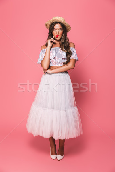 Full length portrait of brunette glamour woman 20s wearing straw Stock photo © deandrobot