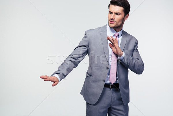 Businessman showing stop gesture Stock photo © deandrobot