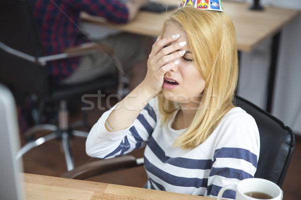 Frustrated young woman in office Stock photo © deandrobot