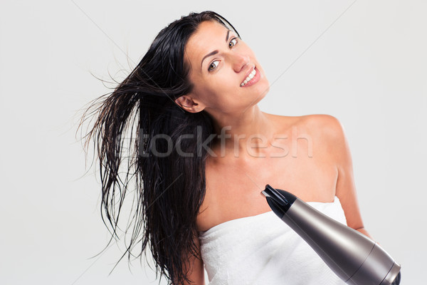 Cheerful woman in towel drying her hair Stock photo © deandrobot