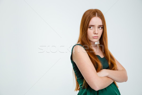 Woman standing with arms folded Stock photo © deandrobot