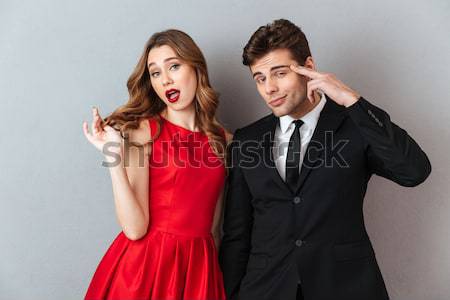 Homme peur jeune femme bande fusil [[stock_photo]] © deandrobot