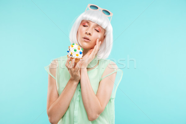 Portrait of attractive sensual blonde young woman with cupcake Stock photo © deandrobot