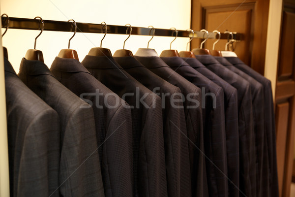 Photo of rack with suits Stock photo © deandrobot