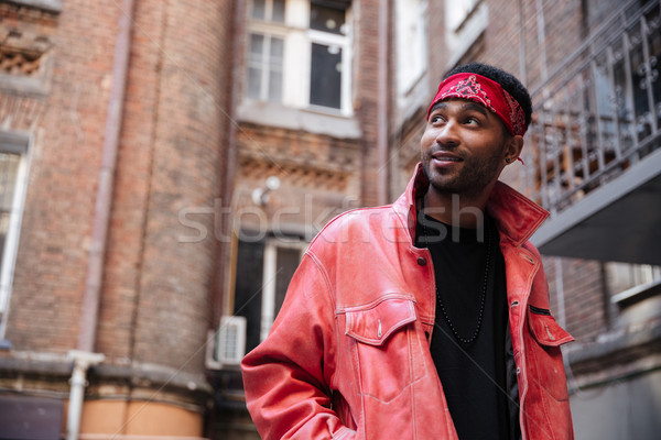 Portrait of a stylish afro american hipster guy wearing headband Stock photo © deandrobot