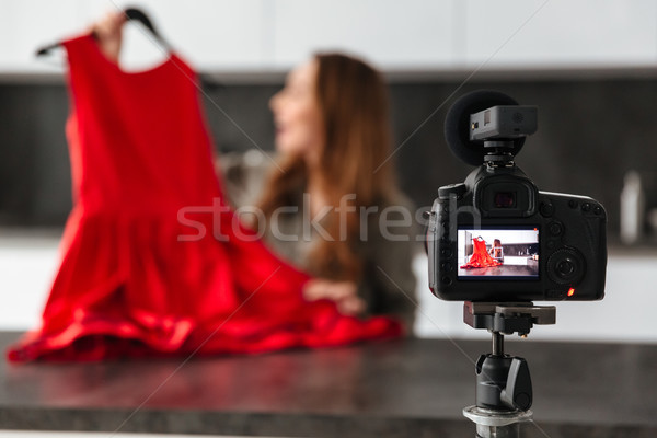 Pretty young girl recording her video blog episode Stock photo © deandrobot