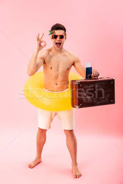 Man standing with rubber ring Stock photo © deandrobot