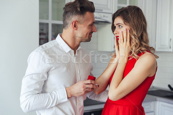Fiatal jóképű férfi eljegyzési gyűrű barátnő otthon fehér Stock fotó © deandrobot