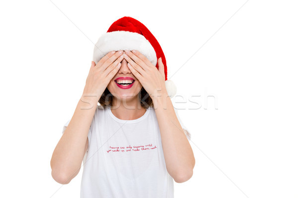 Pretty caucasian woman wearing christmas hat covering eyes with hands. Stock photo © deandrobot
