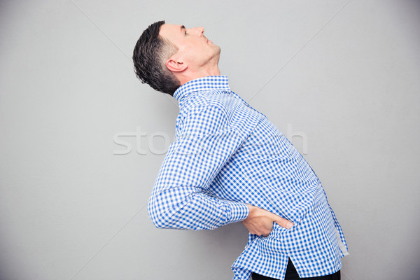 Man having a back pain Stock photo © deandrobot