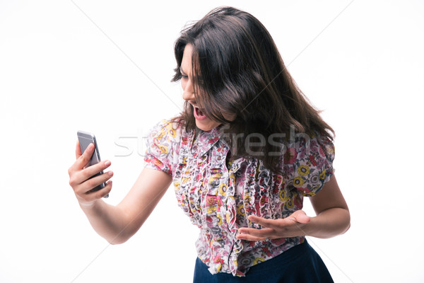 Woman shouting on smartphone Stock photo © deandrobot